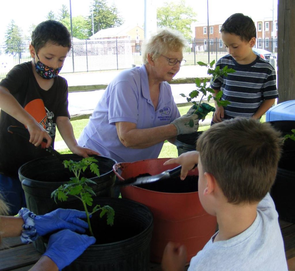 Picture of the Montessori Youth Planting plants